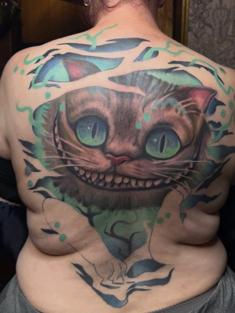 Grinsekatze Tattoo Rückentattoo